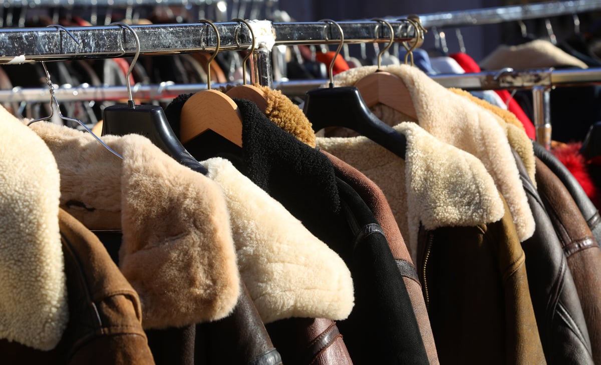 Vintage clothing stall with shirts and jackets for sale