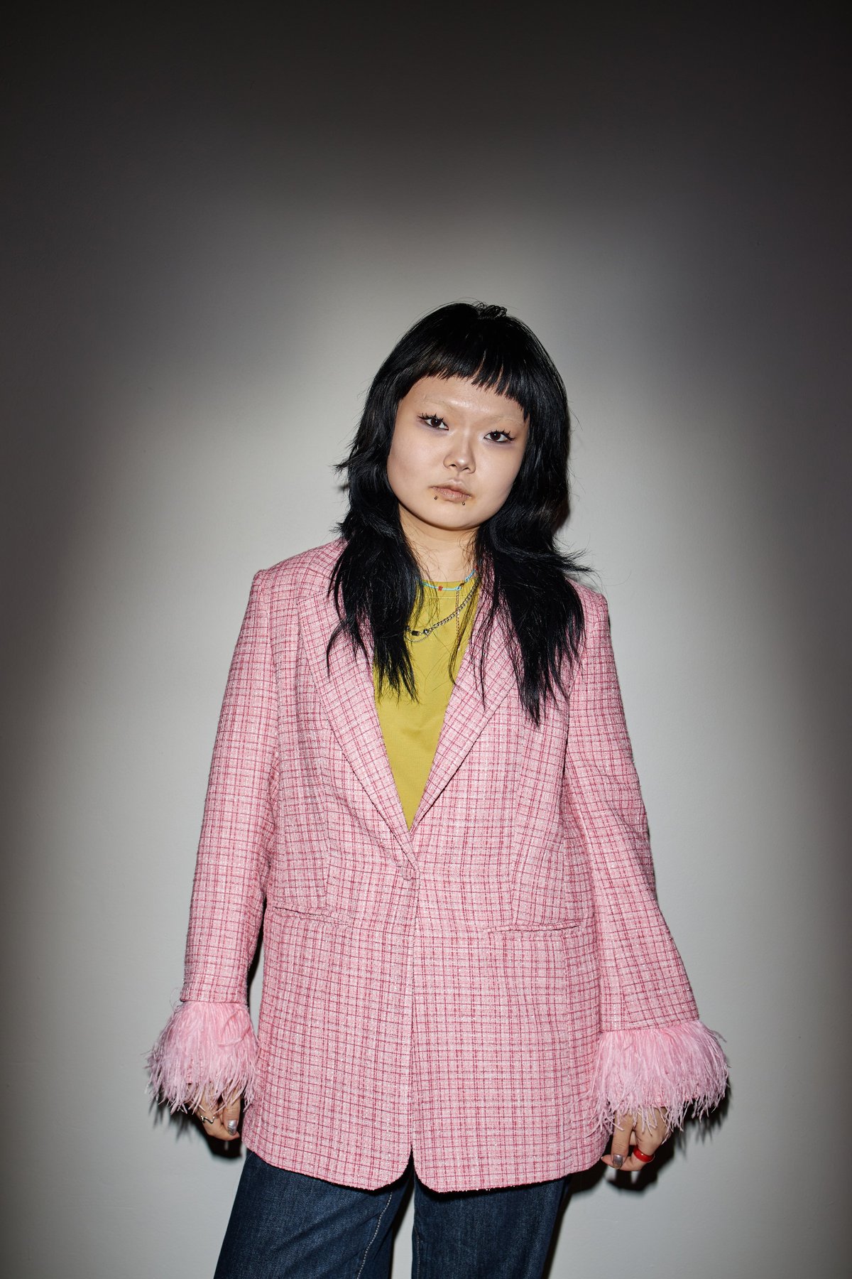 Young woman in stylish secondhand clothing with a bag
